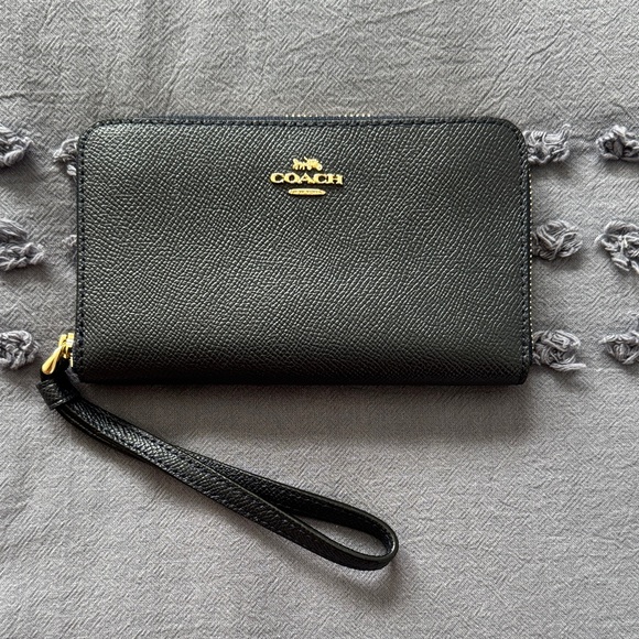 Coach Handbags - Coach Navy Leather Wristlet with Gold Accents